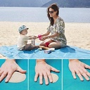 This trekking mat is sand-repellent/بساط الرحلات مقاوم للرمال