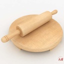 The rolling of wooden dough with a roll/فرادة العجين الخشبية مع رولة